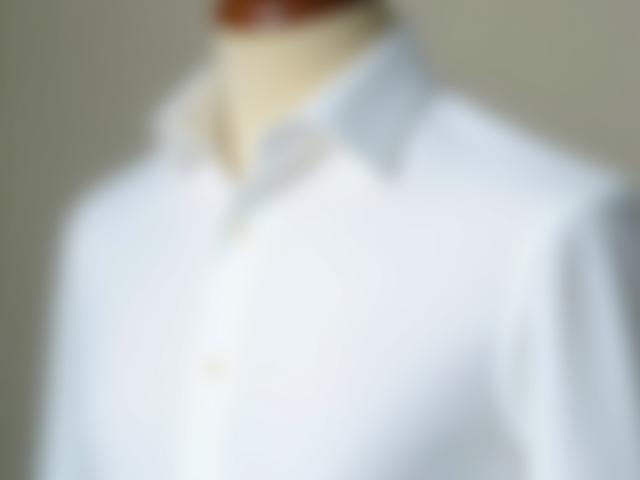 Luxury ready-to-wear white shirt displayed on mannequin